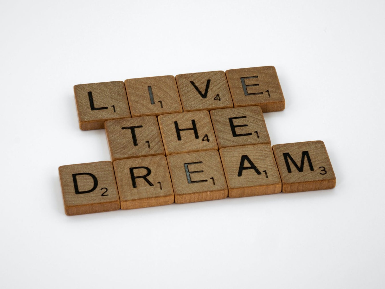 scrabble letter tiles forming a message